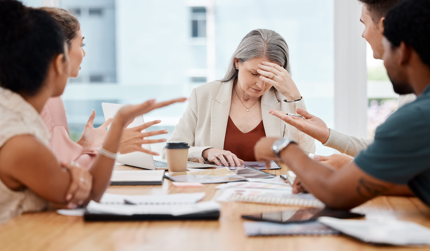 Frustrated business owner in a tense meeting after hiring the wrong HubSpot expert