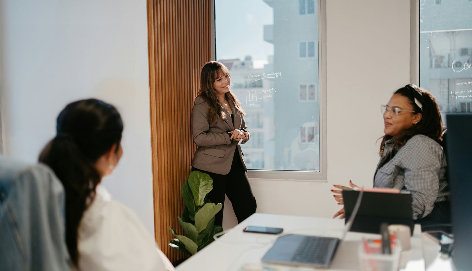 Marketing team meeting to evaluate local vs national SEO agency options for their Raleigh business